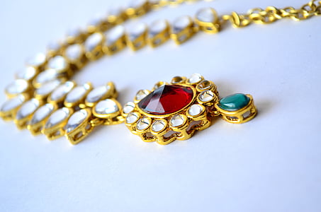 gold-colored necklace with pendant and gemstone lot thumbnail