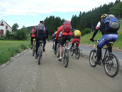 group of men riding bicycle thumbnail
