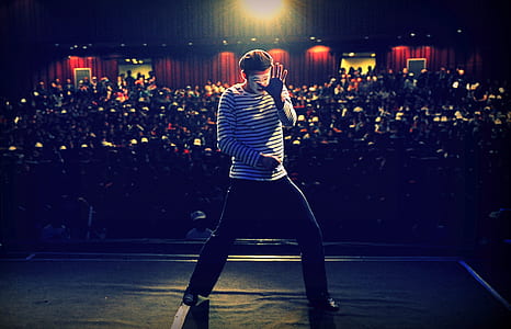 man dancing in front of crowd thumbnail