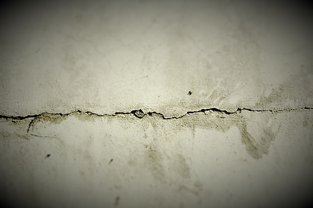 macro shot of cracked white concrete wall thumbnail