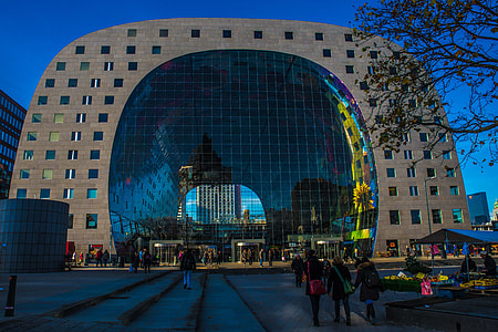 people walking in front of arch building thumbnail