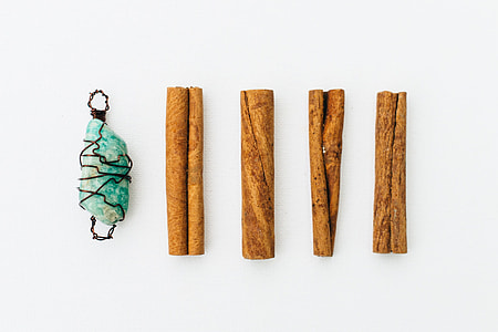 four wood pieces beside gemstone thumbnail