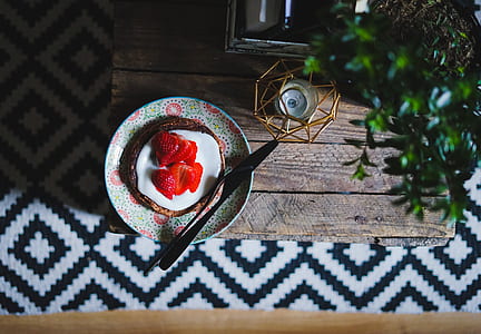 sliced strawberries pancake on green plate thumbnail