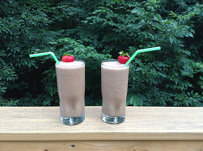 two milkshakes on brown wooden surface thumbnail