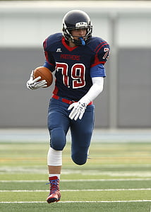 Panthers 79 football player running on football field thumbnail