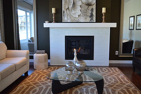 glass-top table near fireplace thumbnail