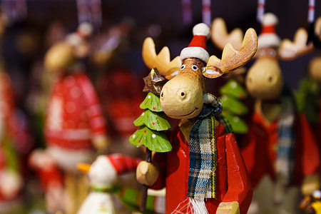 selective focus photography of wooden moose figurine thumbnail