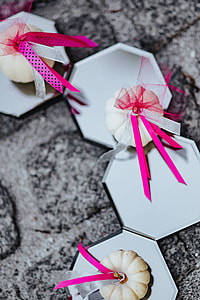 Decorative white pumpkin trinkets with ribbons on the floor thumbnail