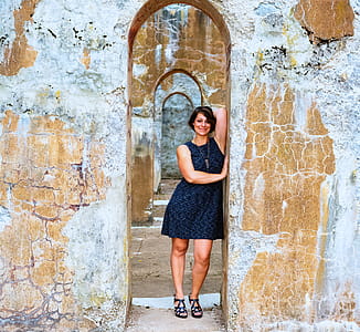 Woman Leaning On Brown Structure thumbnail