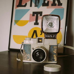 close up photography of gray and blue camera thumbnail