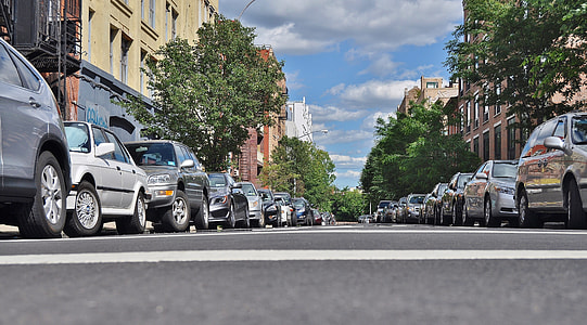 low-angle view photograph asphalt road between cars thumbnail