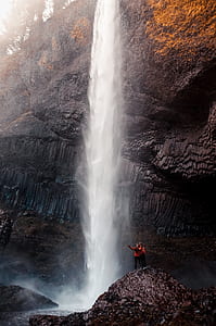 two person looking on waterfalls thumbnail