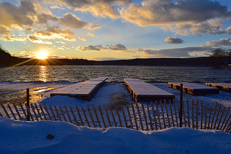 body of water under blue sky during golden hour thumbnail