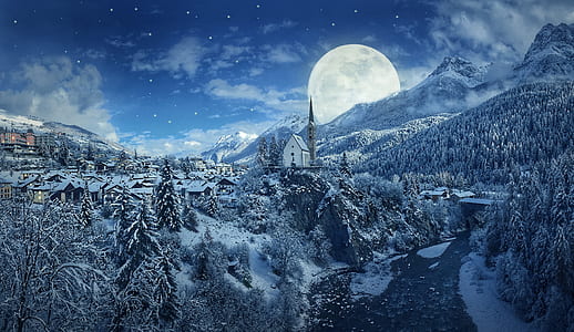 village covered with snow beside tress and mountain during full moon thumbnail