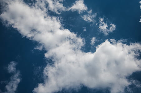 worms eye view of sky covered by clouds thumbnail