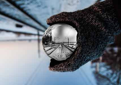 person holding silver ball thumbnail
