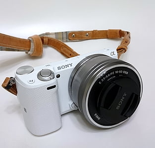 white and silver Sony α DSLR camera thumbnail