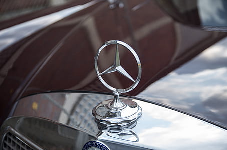selective focus photography of Mercedes-Benz emblem thumbnail