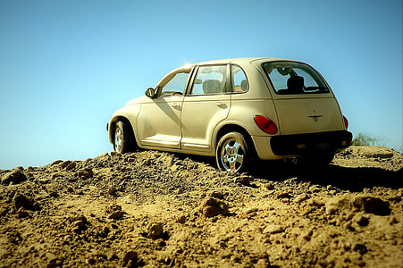 white Chrysler PT Cruiser on off road thumbnail