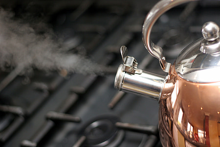 steam coming out of whistling kettle on stove thumbnail