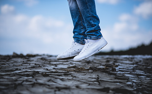 person jumping on dried land thumbnail