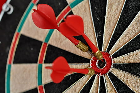 three red dart pins on bulls eyes thumbnail