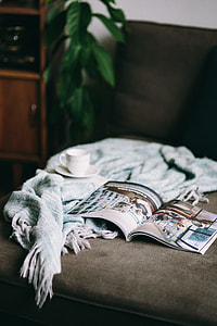 Resting with magazine and cute puppy thumbnail