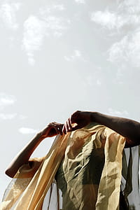 person standing covered by textile thumbnail