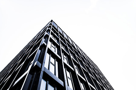 worms eye view of black wall building during daytime thumbnail