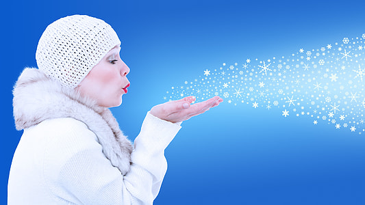 woman blowing snow flakes thumbnail