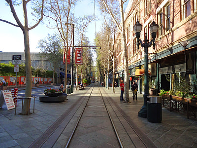Downtown San Jose sidewalk in San Jose, California with trees and buildings thumbnail