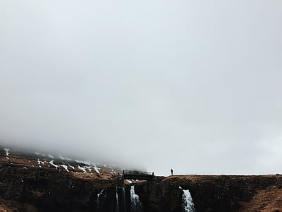 person standing near bridge thumbnail