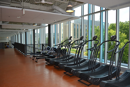 black treadmills near clear glass window thumbnail