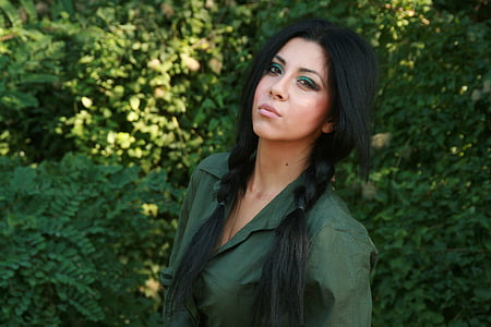 woman wearing green collared top thumbnail