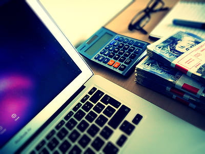 gray calculator beside MacBook Air thumbnail