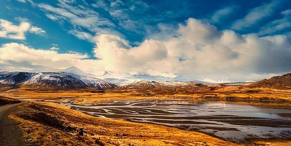 landscape photo of mountain under white clouds at daytime thumbnail