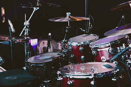 red and black drum set with microphones thumbnail