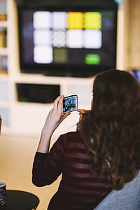 Girl taking picture with mobile thumbnail