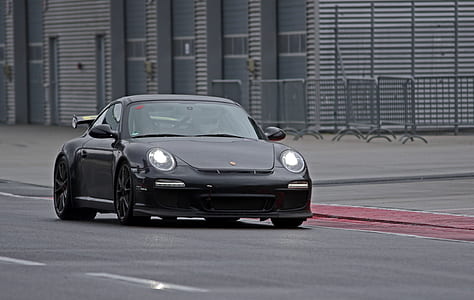black coupe running on gray asphalt road during daytime thumbnail