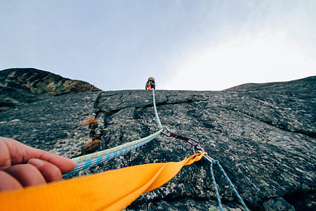 low angle photography of a person holding harness thumbnail