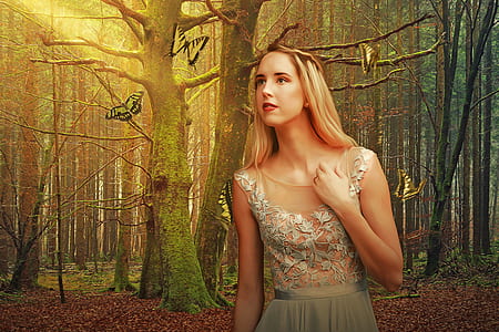 woman standing near leafless tree thumbnail