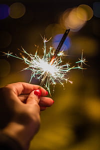 Person Holding Gray Firework thumbnail
