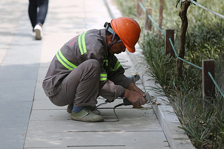 man grinding the edge of concrete road thumbnail