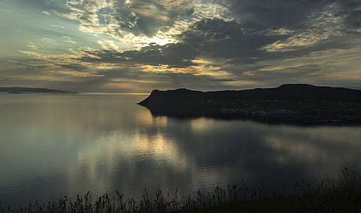 landscape photography of island beside body of water thumbnail