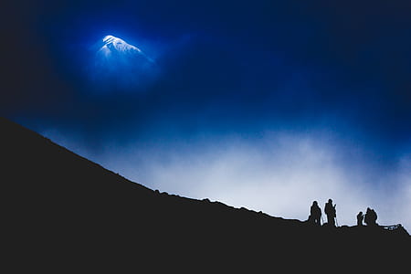 silhouette of person on mountain thumbnail