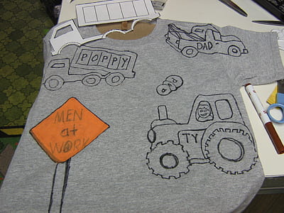 gray t-shirt on table thumbnail