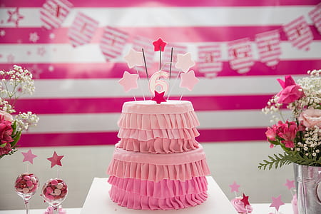 pink cake on white stand thumbnail
