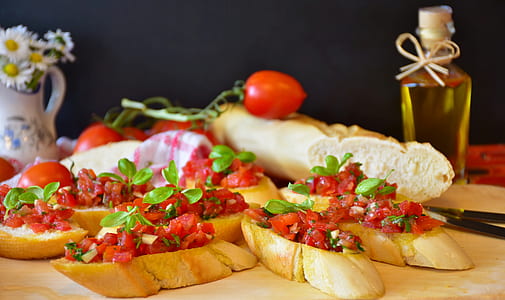 bruschetta on top of brown wood board thumbnail