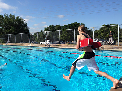 man in white pants jumping in pool thumbnail