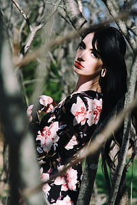 woman standing by tree at daytime thumbnail